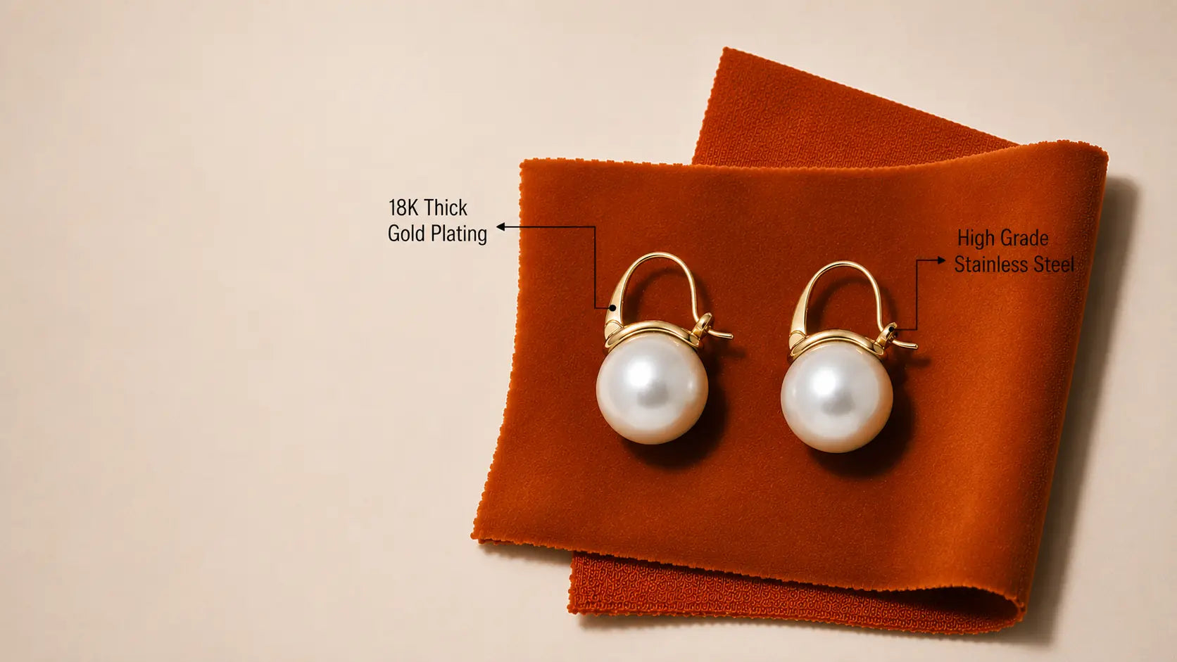 A pair of gold-plated pearl hoop earrings displayed on folded orange fabric against a light beige background, with text callouts describing the materials.
