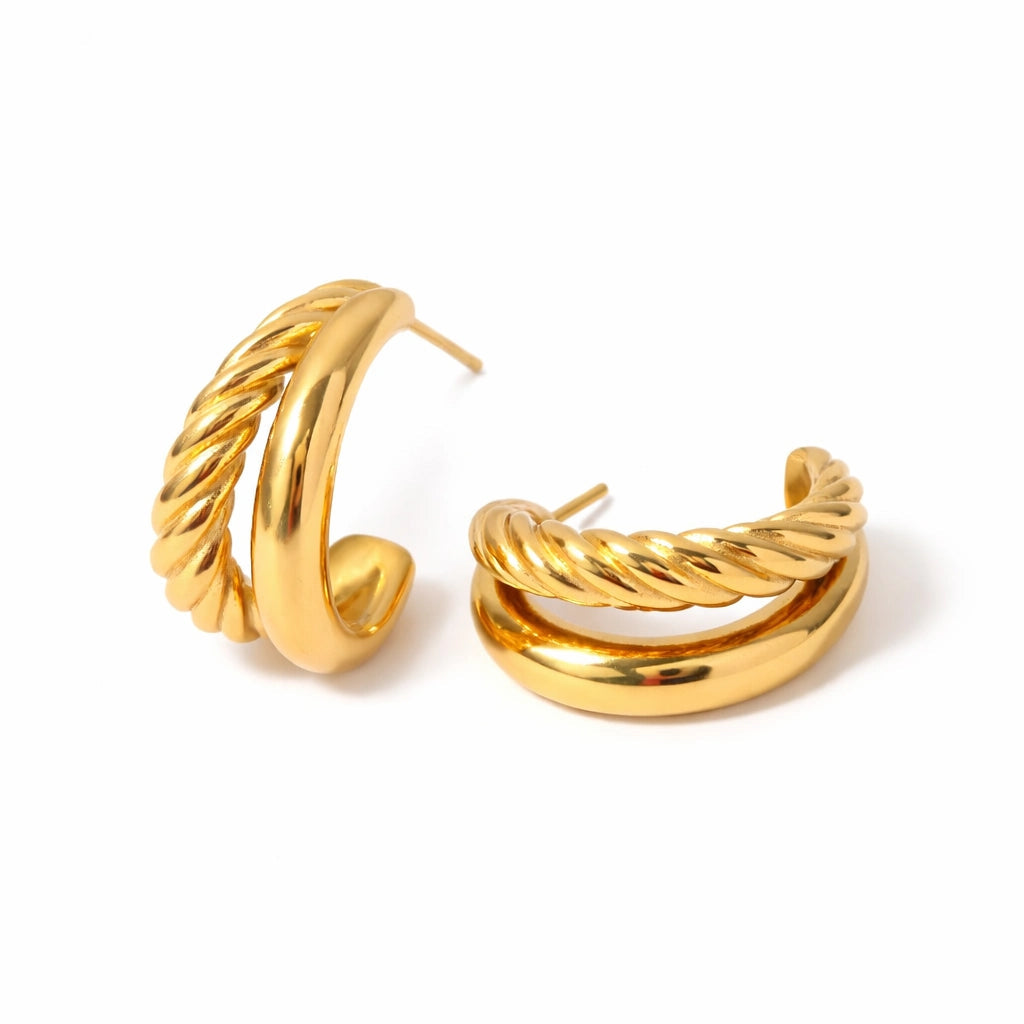 Pair of gold hoop earrings on a white background